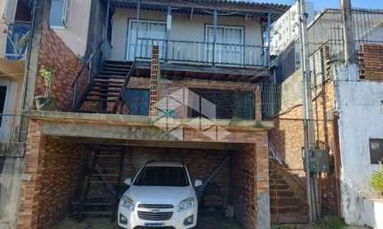 Casa à venda com 3 quartos/dormitórios, 2 vagas no bairro Santo Antônio em Porto Alegre.