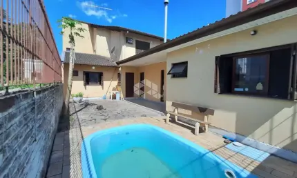 Casa ampla 4 dormitórios, suíte, 4 banheiros, piscina, 4 vagas, bairro Operário, Novo Hamburgo. Aceita financiamento e FGTS.