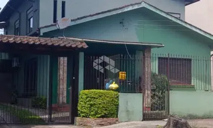 Casa com 6 dormitórios, 1 suite master, 4 banheiros, 5 vagas. Bairro Rio Branco em Novo Hamburgo. Aceita financiamento bancário.