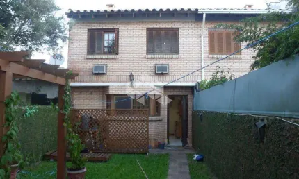 Casa com 3 quartos à venda na Rua Jacipuia, 268, Guarujá, Porto Alegre
