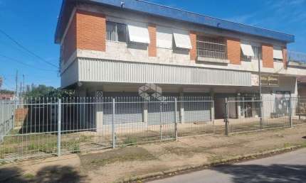 Excelente Prédio com Amplo Apartamento com 3 dormitórios, suíte no segundo andar com garagem e 3 lojas grandes no térreo em avenida no bairro Sarandi