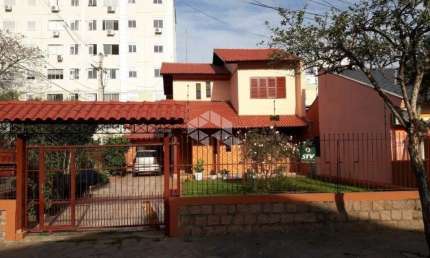 Casa com 3 quartos à venda na Rua Investigador Pedro Loeci Martins, 127, Nonoai, Porto Alegre