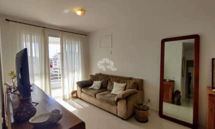 APARTAMENTO NO BAIRRO COQUEIROS, EM FLORIANÓPOLIS, SC, SEMI-MOBILIADO, SACADA, CHURRASQUEIRA, 03 QUARTOS SENDO 01 SUÍTE, 02 VAGAS DE GARAGEM.