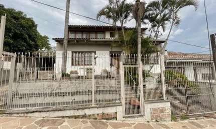 Casa com 4 quartos à venda na Rua João Bonuma, 110, Coronel Aparício Borges, Porto Alegre
