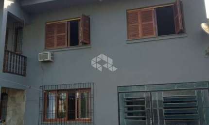 Casa de 03 dormitórios no Bairro Neópolis em Gravataí.