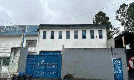 Prédio comercial tipo galpão com área produtiva/estoque e escritório c/entrada p caminhão.