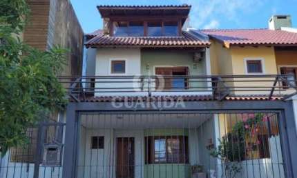 Casa com 6 quartos à venda na Rua Claudio da Silva Pinto, 34, Espírito Santo, Porto Alegre por R$ 1.050.000
