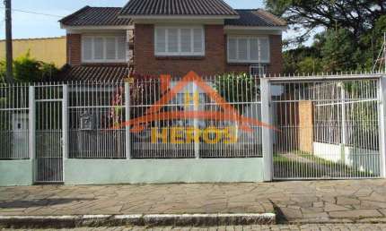 Casa com 3 quartos à venda na Rua Carlos Ferreira, 34, Teresópolis, Porto Alegre por R$ 950.000