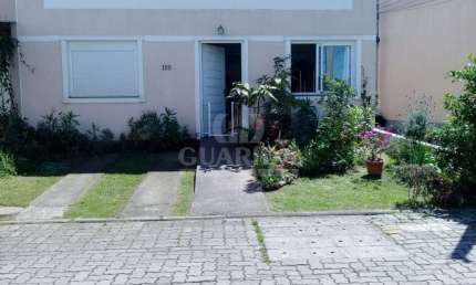 Casa em condomínio fechado com 1 quarto à venda na Rua Capitão Pedroso, 416, Restinga, Porto Alegre por R$ 205.000