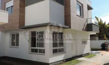 Casa em condomínio fechado com 3 quartos à venda na Rua Paraguá, 54, Vila Assunção, Porto Alegre por R$ 1.150.000