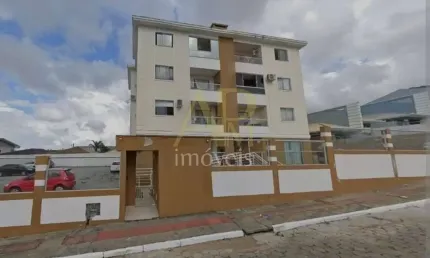 Apartamento à venda em Forquinhas com 2 dorm e sacada com churrasqueira