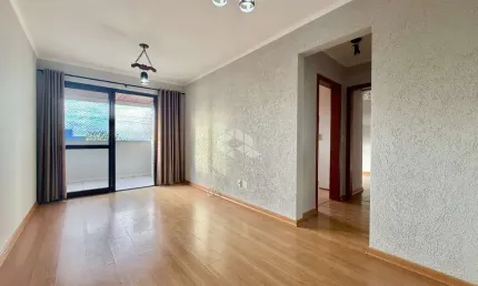 Apartamento com sacada e churrasqueira, 2 dormitórios e 1 vaga no bairro São Sebastião