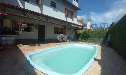 CASA EM CONDOMÍNIO COM 4 DORMITÓRIOS PISCINA 245M2 NO BAIRRO ECOVILLE