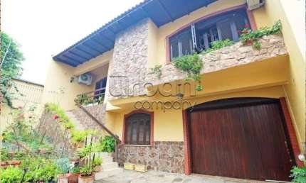 Casa em condomínio fechado com 3 quartos à venda na Rua Umbú, 137, Passo da Areia, Porto Alegre por R$ 1.300.000