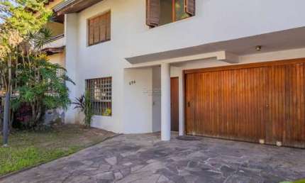 Casa em condomínio fechado com 3 quartos à venda na Rua Doutor Prudente de Moraes, 374, Chácara das Pedras, Porto Alegre por R$ 1.550.000
