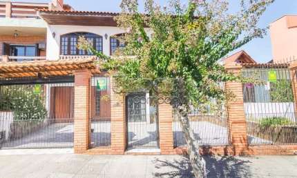 Casa em condomínio fechado com 5 quartos à venda na Travessa Kuluene, 339, Coronel Aparício Borges, Porto Alegre por R$ 634.800