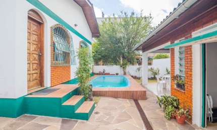 Casa em condomínio fechado com 3 quartos à venda na Rua Congo, 110, Vila Ipiranga, Porto Alegre por R$ 1.100.000