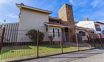 Casa em condomínio fechado com 6 quartos à venda na Rua Paulo Blaschke, 670, Jardim Planalto, Porto Alegre por R$ 1.650.000