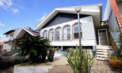 Casa em condomínio fechado com 4 quartos à venda na Rua Paulino Chaves, 427, Santo Antônio, Porto Alegre por R$ 1.170.000