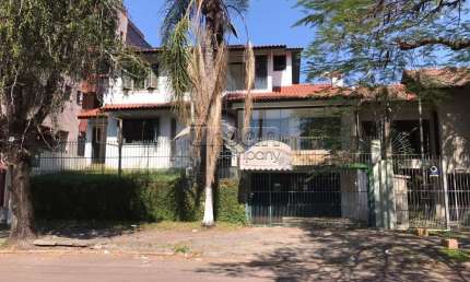 Casa em condomínio fechado com 3 quartos à venda na Avenida Quito, 415, Jardim Lindóia, Porto Alegre por R$ 1.500.000