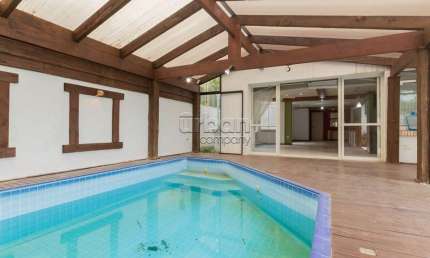 Casa em condomínio fechado com 4 quartos à venda na Rua Indianápolis, 240, Três Figueiras, Porto Alegre por R$ 1.890.000