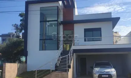 Casa em condomínio fechado com 3 quartos à venda na Rua Antônio Ramos, 440, Loteamento Jardim Timbaúva, Gravataí por R$ 1.090.000