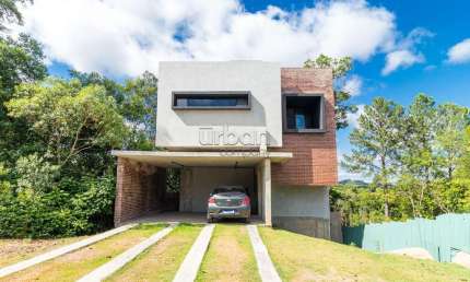 Casa em condomínio fechado com 3 quartos à venda na Tapir Rocha, 8500, Condomínio Buena Vista, Viamão por R$ 1.350.000
