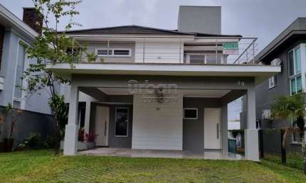 Casa em condomínio fechado com 4 quartos à venda na Ibitirá, 49, Alphaville, Gravataí por R$ 1.670.000