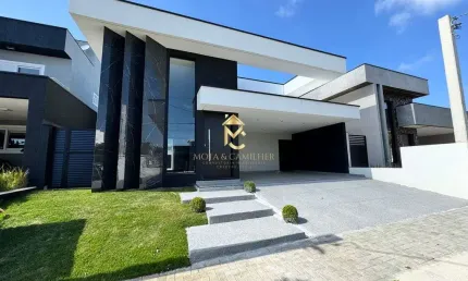 Casa térrea com planejados e 3 suítes à venda em condomínio.