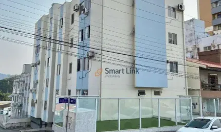 Apartamento com 2 dormitórios à venda, 58 m² por R$ 310.000,00 - Barreiros - São José/SC