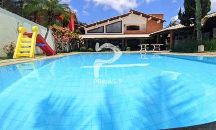 Casa em condomínio fechado com 5 quartos à venda na Amadeu Fernandes Conde (rua 21), --, Jardim Acapulco, Guarujá por R$ 3.100.000