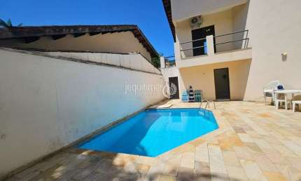 Casa em condomínio fechado com 3 quartos para alugar no Balneário Praia do Pernambuco, Guarujá  por R$ 8.500