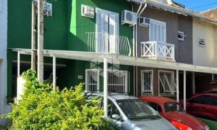 Casa em condomínio fechado com 3 quartos à venda na Rua Osório Mendes Ouriques, 332, Guarujá, Porto Alegre