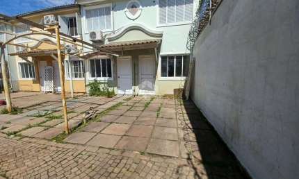 Casa em Condomínio com 2 dormitórios, aceita financiamento no Bairro Rio Branco/Canoas -RS.