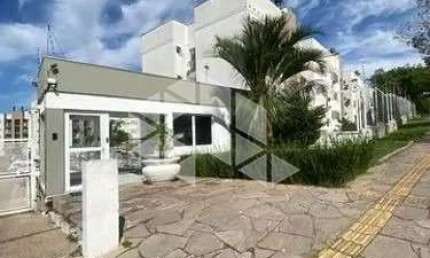 Apartamento térreo com 60 m², 2 dormitórios, churrasqueira e 1 vaga na Cavalhada