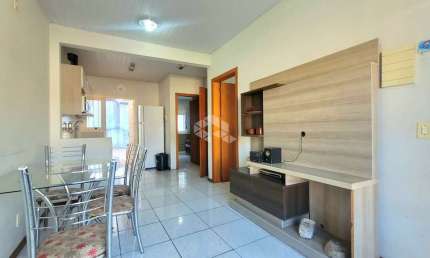 Casa térrea 02(dois) dormitórios, ampla sala e living cozinha montada, ampla, lavanderia e área de serviço. Aceita financiamento.  Possui pátio todo
