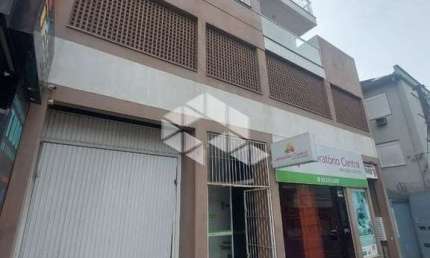 Apartamento 02 dormitórios com garagem a venda no Centro
