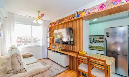 Apartamento 2 quartos sendo uma suíte, 1 vagas de garagem, living com churrasqueira, mobiliado com móveis planejados.