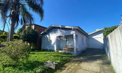 Casa 3 dormitórios com 1 suite e amplo terreno em campo bom