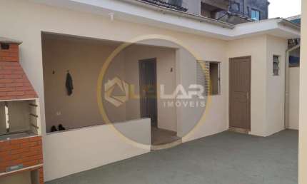 Casa térrea com edícula na ponta da praia em Santos