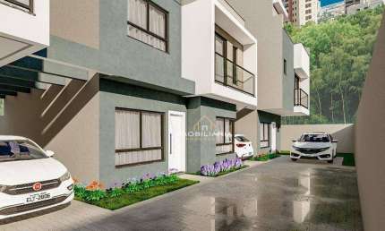 Sobrado com 3 dormitórios à venda, 122 m² por R$ 670.000,00 - Uberaba - Curitiba/PR