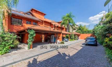 Casa em condomínio fechado com 4 quartos para alugar na Rua Ênio Andrade, 320, Três Figueiras, Porto Alegre, 650 m2 por R$ 35.000