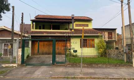 Casa para locação em Porto Alegre-RS, Passo das Pedras: 6 quartos, 1 suíte, 5 salas, 4 banheiros, 3 vagas de garagem, 419,84 m²