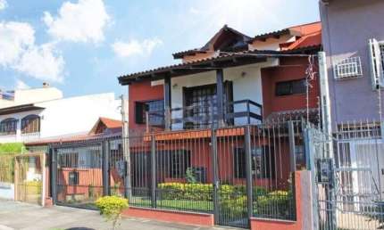 Casa com 4 quartos à venda na Travessa Kuluene, Partenon, Porto Alegre, 299 m2 por R$ 901.550