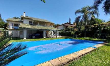 Casa em condomínio fechado com 3 quartos à venda na Avenida Firmino Octávio Bimbi, 255, Cavalhada, Porto Alegre