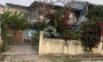 TERRENO COM DUAS CASAS EM SÃO JOSÉ - SC Á VENDA POR R$ 950.000,00.