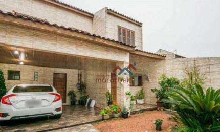 Sobrado com piscina e 4 dormitórios à venda, 164m² por R$ 636.000,00 - Igara - Canoas/RS