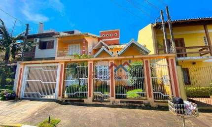 Casa com 4 dormitórios à venda, 190 m² por R$ 948.000,00 - Moinhos de Vento - Canoas/RS