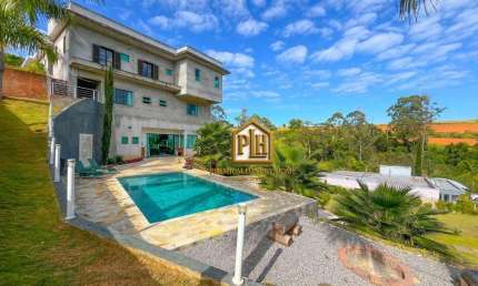 Casa com 7 dormitórios, 630 m² - venda por R$ 3.000.000 ou aluguel por R$ 18.850/mês - Condomínio Portal Ouro Verde - Atibaia/SP