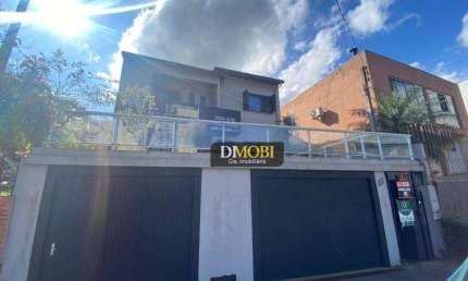 Sobrado com 4 dormitórios para alugar, 190 m² por R$ 5.460,00/mês - Oriço - Gravataí/RS